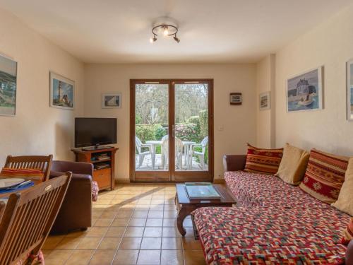 Μια τηλεόραση ή/και κέντρο ψυχαγωγίας στο Holiday Home Le Pré Verger-1 by Interhome