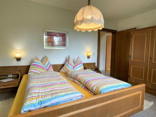 two pillows on a bed in a room at Apartment Helga by Interhome in Fieberbrunn