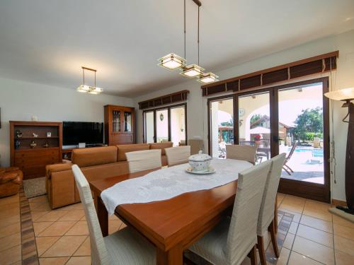 a dining room with a table and chairs at Holiday Home Los Olivos by Interhome in Benimallunt