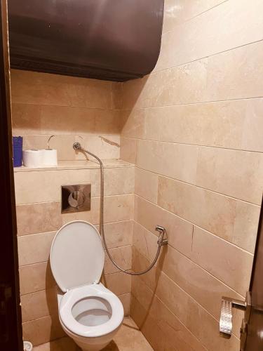 a bathroom with a toilet and a shower at Deluxe apartments in Casablanca