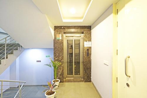 a hallway with a door in a building at Mayda Inn- A Boutique Hotel in New Delhi