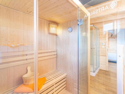 a sauna with a shower and a glass door at Holiday Home Chalet Toni mit Sauna by Interhome in Spiegelau