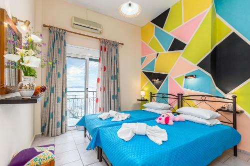 Postel nebo postele na pokoji v ubytování Riviera Seaside Hotel