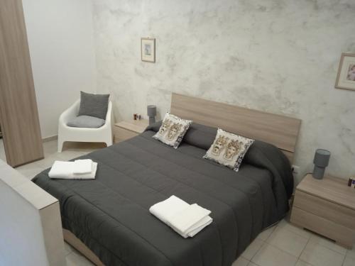 Posteľ alebo postele v izbe v ubytovaní Case Serena vacanze relax