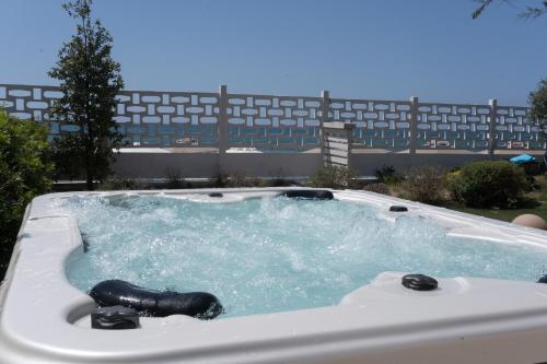 a jacuzzi bathtub with at Le Palme Village in Terracina