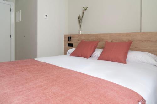 Una cama o camas en una habitación de Albatros