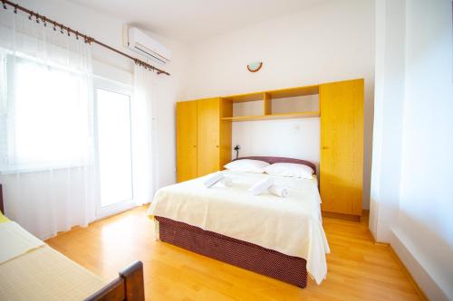 Voodi või voodid majutusasutuse Garden Resort - Apartments Ruzmarin toas