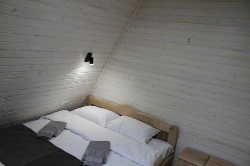 a bed in a corner of a room at Soul House in Pilipets