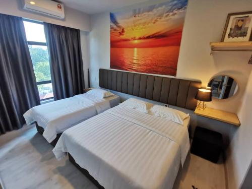 two beds in a hotel room with a painting on the wall at K'S11 JQ Homestay Jesselton Quay Citypads Kota Kinabalu in Kota Kinabalu