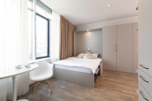 Ένα ή περισσότερα κρεβάτια σε δωμάτιο στο Brera Serviced Apartments Munich West