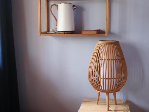 a wooden vase sitting on a table in a room at Associação Quinta das Relvas in Branca