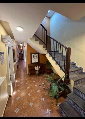 a staircase in a house with a stair case at Hotel Victorina de Híjar in Tequila