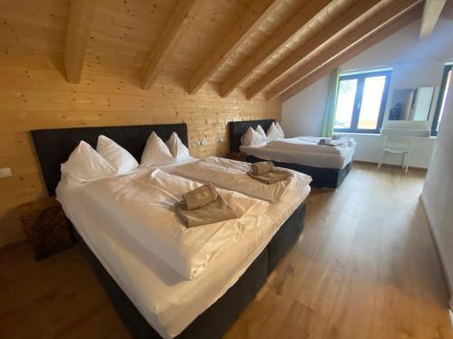 a bedroom with two beds in a room at Chalet Reiteralm- SKI-IN SKI-OUT in Schladming