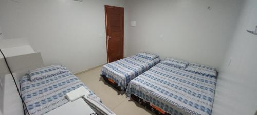 Habitación con 2 camas en una habitación en A.N Hotel en Boa Vista