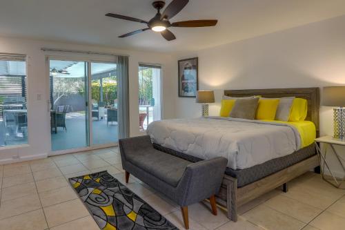 a bedroom with a bed and a ceiling fan at Sunny Palm Springs Home with Private Pool and Patio! in Palm Springs