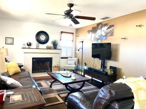 a living room with a couch and a tv at Beautiful Waterfront Home Less Than 7 mins to Beaches in Englewood