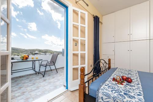 a room with a view of a balcony with a table at Nick & Debbie's two-storey apartment in Mélanes