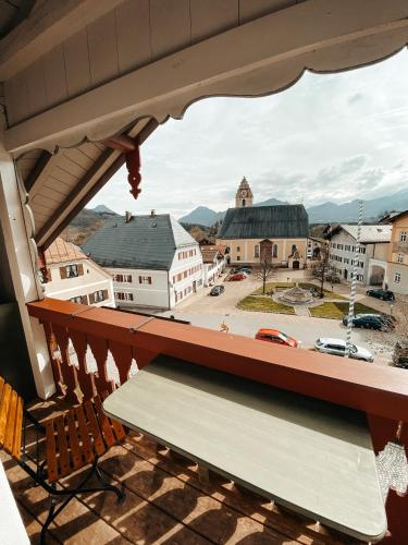 a view of a town from a balcony at Hotel Hofwirt Neubeuern in Neubeuern