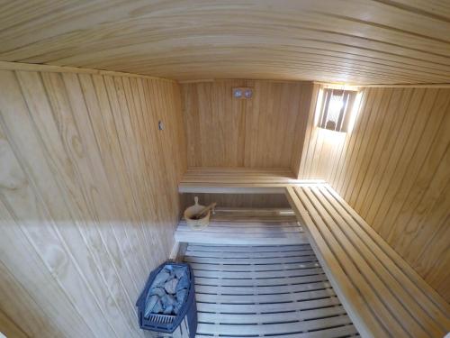 a inside of a wooden sauna with a bench at Hotel y Departamentos La Serena - Caja Los Andes in La Serena