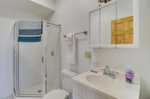 a white bathroom with a shower and a sink at Cozy Marlinton Vacation Rental Downtown Location! in Marlinton