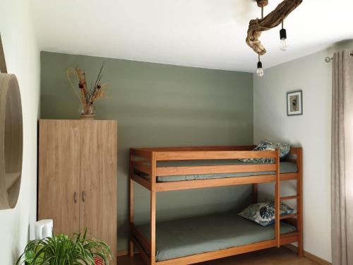 a room with a bunk bed and a shelf at autour du hamac in Moltifao