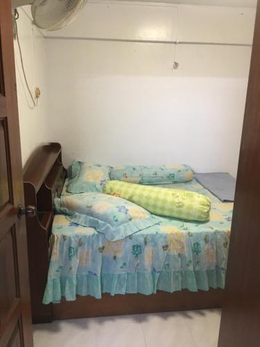 Tempat tidur dalam kamar di Family House