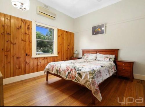 a bedroom with a bed and a window at 4 bedrooms Relaxing farmhouse getaway in Glenmore 