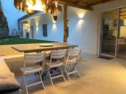 a table and chairs sitting on a patio at Villa Patrizia Pietrasanta in Pietrasanta