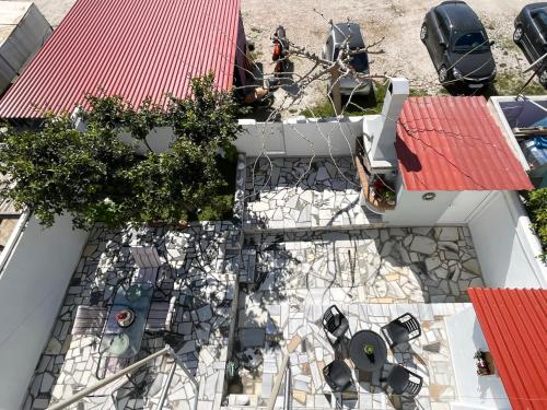 an overhead view of a house with a roof at Sunny Beach House in Korinthos