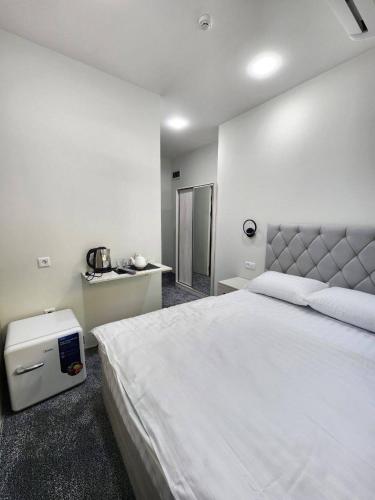Ένα ή περισσότερα κρεβάτια σε δωμάτιο στο Paradise inn