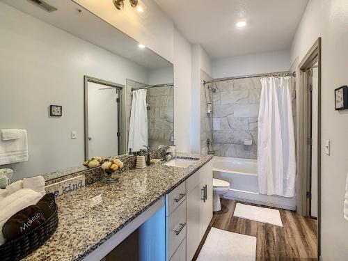 a bathroom with a sink and a toilet and a tub at Perfect And Close To Disney! in Kissimmee