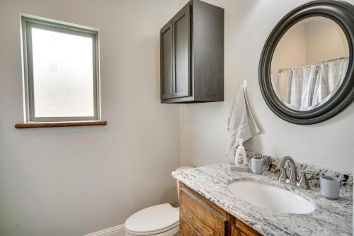 a bathroom with a sink and a mirror at Lake Charles Vacation Rental - 3 Mi to Casinos! in Lake Charles