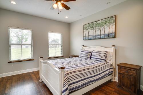 a bedroom with a bed and a ceiling fan at Lake Charles Vacation Rental - 3 Mi to Casinos! in Lake Charles
