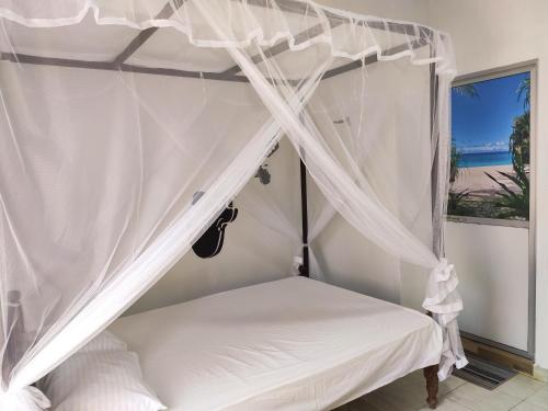 Postel nebo postele na pokoji v ubytování Bird House Homestays