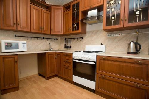 A kitchen or kitchenette at DELUX "Удобно в аэропорт"