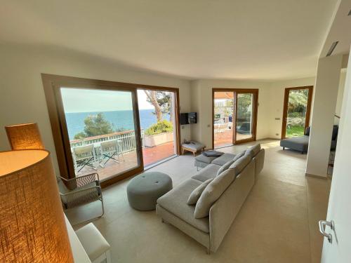 A seating area at Cokkinis villa with garden overlooking the sea