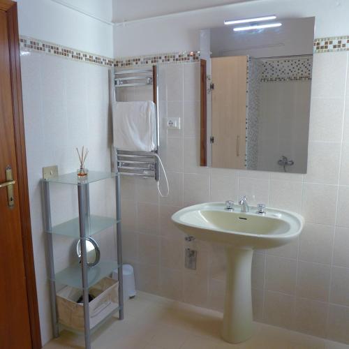a bathroom with a sink and a mirror at Casa in Piazza in Vasto