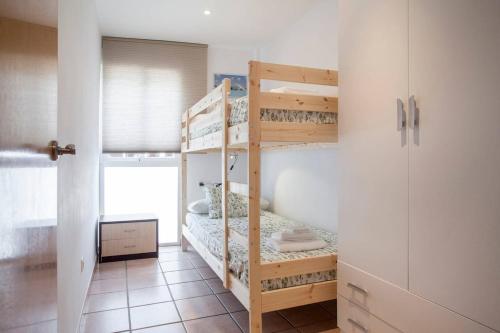a bedroom with two bunk beds in a room at Zerka Ayuntamiento in Valencia