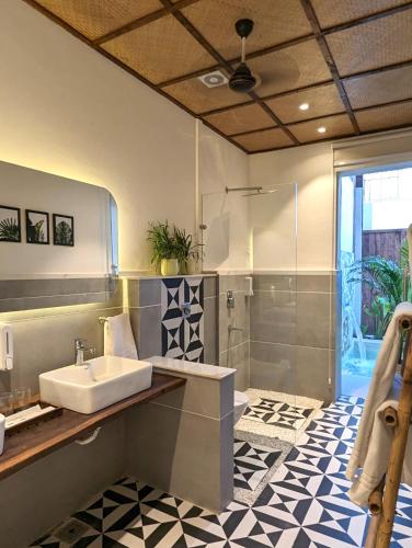 a bathroom with a sink and a shower at Cape House in Amritsar