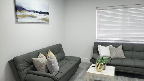 a living room with a couch and a table at Funston in Hollywood