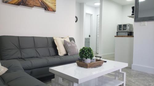 a living room with a couch and a table at Funston in Hollywood