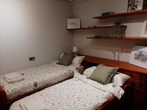 Кровать или кровати в номере Gijon Infiesto laviada