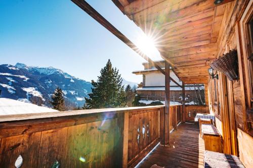 a wooden balcony with a view of a mountain at Magdalena Hütte in Hippach