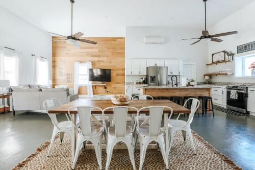 a kitchen and living room with a wooden table and chairs at Afton Clubhouse in Afton