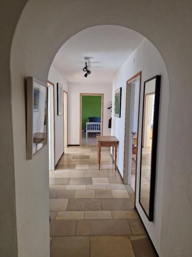 a hallway with an archway in a house at Wohnen am Wasserschloss Sandizell in Schrobenhausen