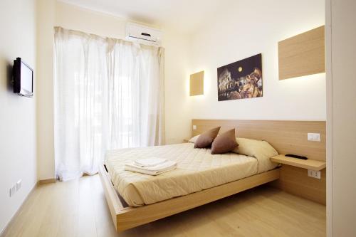 a bedroom with a large bed in a room at Affittacamere Nansen in Rome