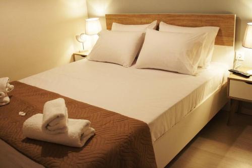 Säng eller sängar i ett rum på Privilege Apartment Corfu Town