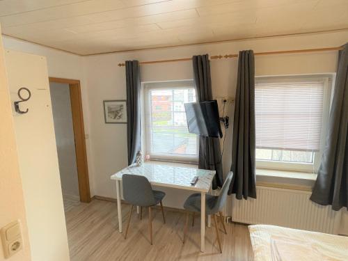 a room with a desk with a computer on it at Ellada Restaurant & Hotel in Tarp
