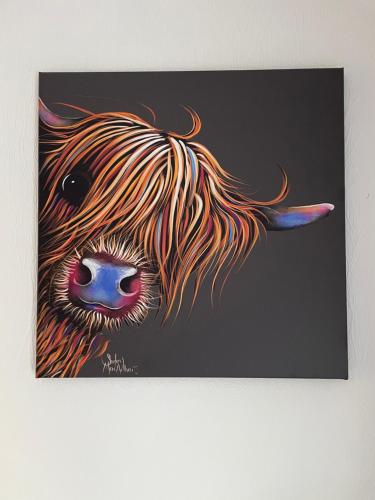 a painting of a cow with a tail at Rhydydefaid Bed and Breakfast, Guesthouse in Frongoch, Snowdonia in Frongoch