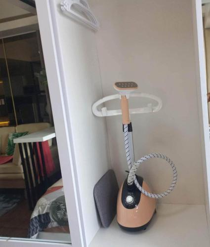 a toy room with a phone hanging from a wall at Luxurious Condotel at the heart of Makati in Manila
